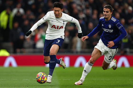 Tottenham striker Son Heung-min runs with the ball during a Premier League match against Leeds United at Tottenham Hotspur Stadium in London on Sunday. [AFP/YONHAP]