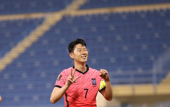 Son Heung-min celebrates scoring a penalty at the second leg of the third round of Asian qualifiers for the 2022 Qatar World Cup against Iraq at Thani bin Jassim Stadium in Doha, Qatar, on Tuesday. The goal marks his 30th international goal on the national team. [YONHAP]