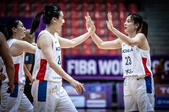 The Korean national women's basketball team celebrate after scoring during a FIBA Women's Asia Cup 2021 match against New Zealand on Sep. 27 in Amman, Jordan. [YONHAP]