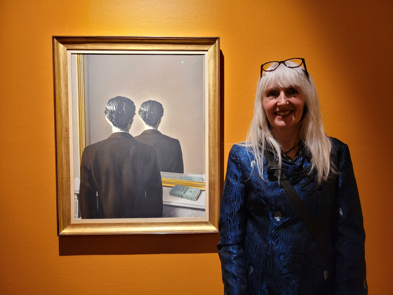 Els Hoek, curator of Museum Boijmans Van Beuningen in Rotterdam, the Netherlands, stands beside Rene Magritte's ″Not to Be Reproduced,″ the highlight of ″The Surreal Shock″ exhibition at the Soul Arts Center's Hangaram Art Museum in southern Seoul.  [MOON SO-YOUNG]