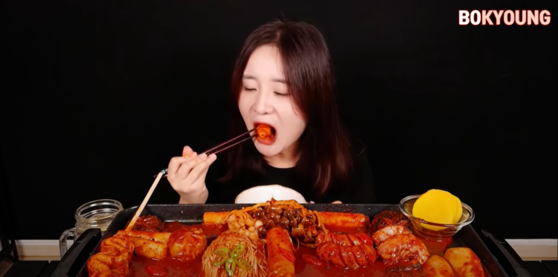 "Mukbang," a livestreamed video featuring a person eating, usually large quantities of food, while communicating with their audience, is considered a neologism in Korea, yet was added to the OED. [SCREEN CAPTURE]
