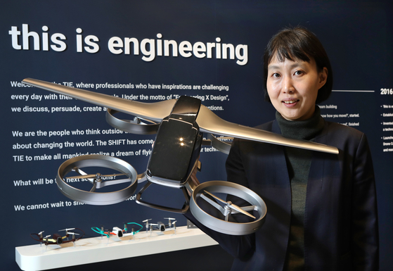 Hong Yoo-jung, founder and CEO of an air mobility start-up, this is engineering(TIE), poses with a miniature aerial vehicle at the company's office in Seongnam, Gyeonggi on Nov. 23. [PARK SANG-MOON]