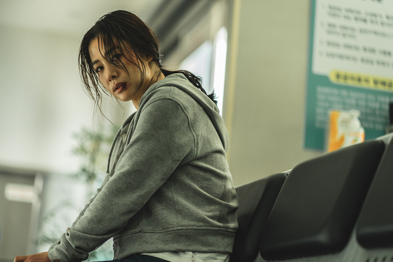 Actor Kim Hyun-joo as lawyer Min Hye-jin in "Hellbound," who initially believes that the judicial system is the key to creating a fair and just society. [NETFLIX] 
