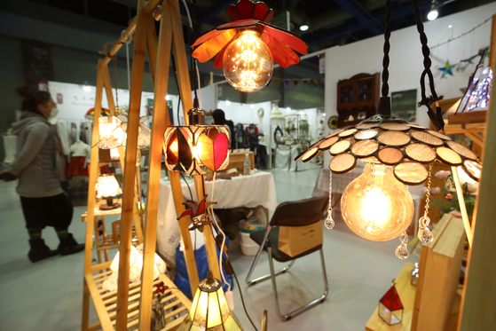 Visitors look at handcrafted furniture at the K-Handmade Fair 2021 held at Coex in Gangnam District, southern Seoul, on Thursday. The event runs through Sunday. [YONHAP]