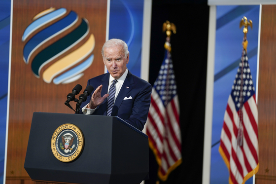 U.S. President Joe Biden speaks to media after delivering closing remarks to the virtual Summit for Democracy at the White House in Washington Friday. The U.S. Treasury announced new sanctions on North Korean, Chinese and Russian individuals and entities for human rights violations on the same day. [AP/YONHAP]