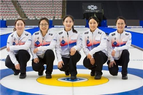 Korean women curlers Team Kim, who won the silver medal at the 2018 PyeongChang Winter Olympics, pose for a photo. [YONHAP]