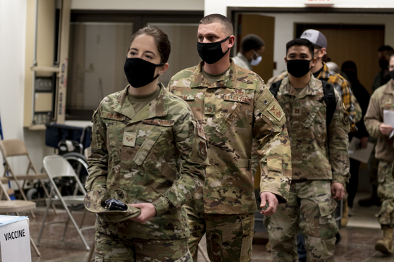 A handout photo made available by the United States Forces Korea (USFK) shows Members of Team Osan preparing to receive their first round of Moderna vaccines at Osan Air Base on Dec. 29, 2020. [EPA/USFK]