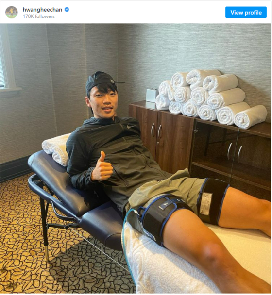 An image uploaded on Hwang Hee-chan's Instagram account shows the Wolverhampton Wanderers striker lying in a recovery suite with strapping on both legs. [SCREEN CAPTURE]