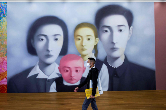 "Bloodline-Big Family No. 17″ by artist Zhang Xiaogang is seen during a press tour of the new M Museum in Hong Kong on Nov. 11. [AFP/YONHAP]