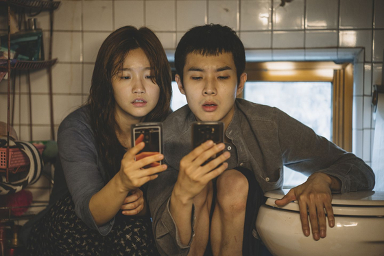 A scene from "Parasite" featuring actors Park So-dam, left, and Choi Woo-shik [CJ ENM]