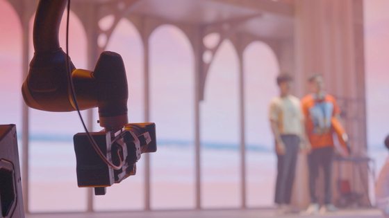 Doosan Robotics' robotic arm films a scene of a musical performance. [DOOSAN GROUP]