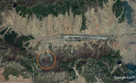 Runways are installed in the mountain and entrances are spotted leading to an underground facility at the Taetan air base in South Hwanghae Province, spotted through satellite imagery. [GOOGLE EARTH]