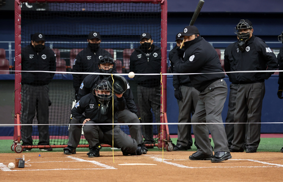 KBO umpires gather at Gocheok Sky Dome in western Seoul for a training day on Tuesday. Among the issues discussed at the event was the stricter enforcement of the league's enlarged strike zone next season. [YONHAP]