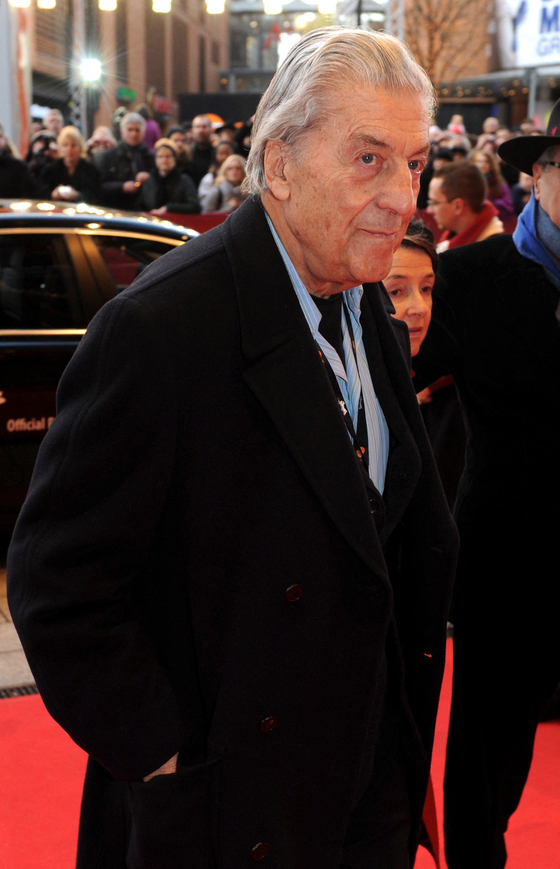 In this file photo taken on February 12, 2011 Italian fashion designer Nino Cerruti arrives on the red carpet for the premiere of the movie ″Sleeping sickness″ by German director Ulrich Koehler in Berlin at the international Berlinale film festival. - - Pioneering Italian fashion designer Nino Cerruti has died at the age of 91, a source in the fashion industry confirmed to AFP on January 15, 2022, following media reports. [AFP/YONHAP]
