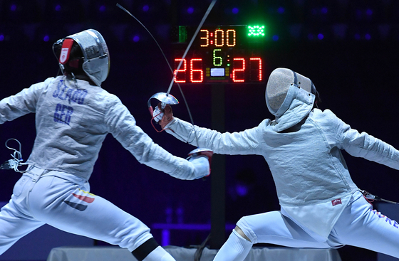 Kim Jun-ho, right, competes with Matyas Szabo of Germany during the men's team sabre final match between Korea and Germany at the Fencing World Cup 2022 in Tbilisi, Georgia on Monday. [XINHUA/YONHAP]