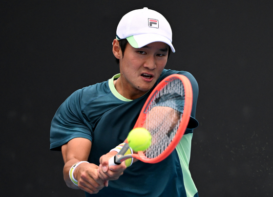 Kwon Soon-woo in action during his first round match against Denmark's Holger Rune on Monday at the Australian Open in Melbourne Park, Melbourne. [REUTERS/YONHAP]