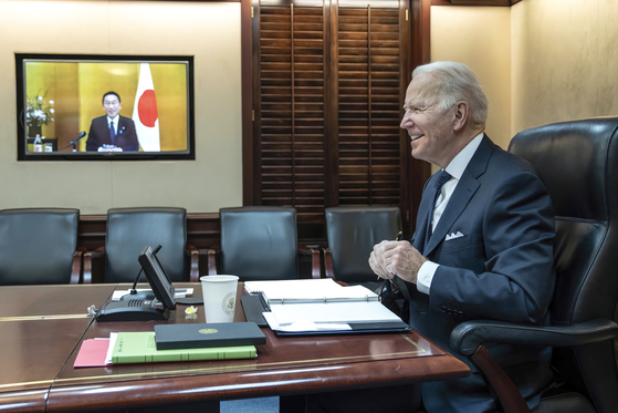 In this image provided by the White House, U.S. President Joe Biden meets virtually from the Situation Room at the White House with Japanese Prime Minister Fumio Kishida on Friday, Jan. 21, in Washington, D.C. [AP]