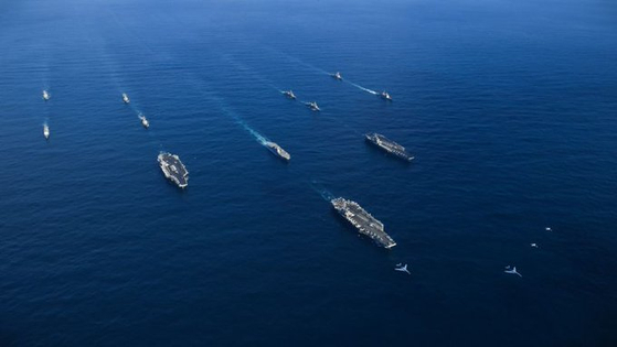 The aircraft carriers USS Ronald Reagan, Theodore Roosevelt and Nimitz, and their multi-ship strike group,s undertake four days of exercises in November 2017 in the waters between South Korea and Japan. [U.S. NAVY]