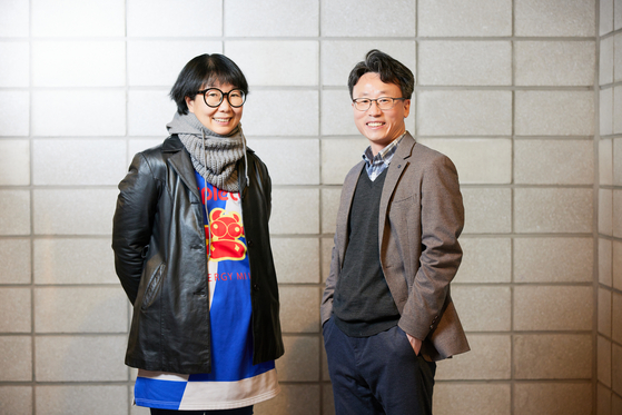 Co-directors Kim Jung-kyung, left, and Lee Hyuk-rae of "Sewing Sisters" pose for photos after a press screening in January. [JIN JIN PICTURES] 
