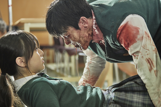 A scene from Netflix Korea's original series "All of Us Are Dead" where one of the main protagonists On-jo (played by actor Park Ji-hu) stares in disbelief at a student-turned-zombie in the cafeteria. [NETFLIX]