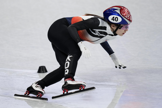 Choi Min-jeong races in the 2022 Beijing Olympics women's 500-meter short track speed skating heat at the Capital Indoor Stadium in Beijing on Saturday. [AP/YONHAP]