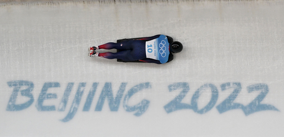 Jung Seung-gi competes in the men's skeleton event at the Yanqing National Sliding Centre during the Beijing Olympics in Beijing on Thursday. [AFP/YONHAP]