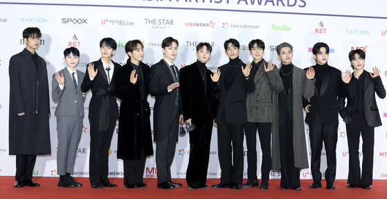 Wonwoo of boy band Seventeen, fourth from right, tested positive for Covid-19 on Saturday, according to his agency Pledis Entertainment. [ILGAN SPORTS]