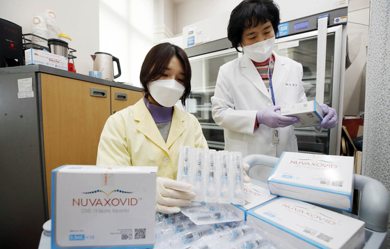 Medical staff at a public health center in Gwangju check Novavax Covid-19 vaccines on Monday, when the country started rolling out the vaccine nationwide. [NEWS1]