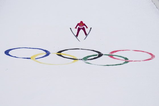 Park Je-un soars through the air during the competition round of the individual Gundersen large hill 10-kilometer ski jumping competition at the 2022 Winter Olympics in Zhangjiakou, China on Tuesday. [AP/YONHAP]