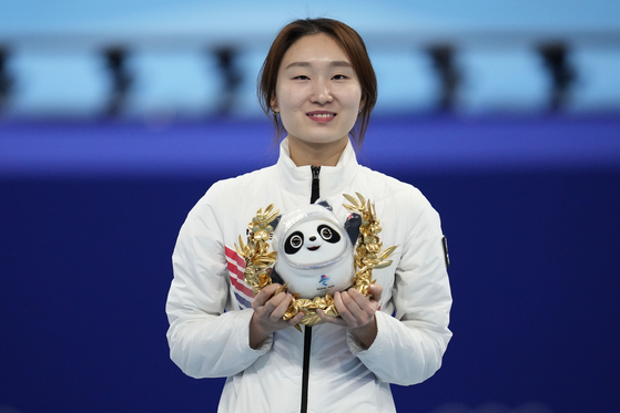 Choi Min-jeong reacts on the podium after winning the women's 1,500-meter final during the short track speed skating competition at the 2022 Winter Olympics on Wednesday at Capital Indoor Stadium in Beijing. [AP/YONHAP]