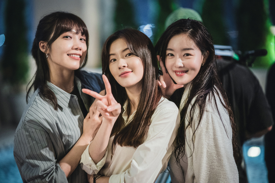 From left, actors Jeong Eunji, Lee Sun-bin and Han Seon-hwa pose for a photo during the filming of Tving original series ″Drink Now, Work Later.″ [TVING]