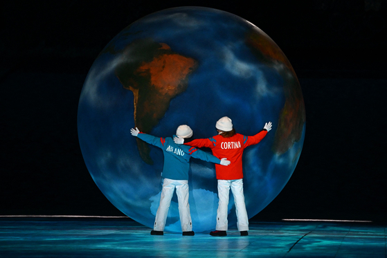 Children perform by a globe during the closing ceremony of the Beijing 2022 Winter Olympic Games, at the National Stadium in Beijing on Sunday. [AFP/YONHAP]