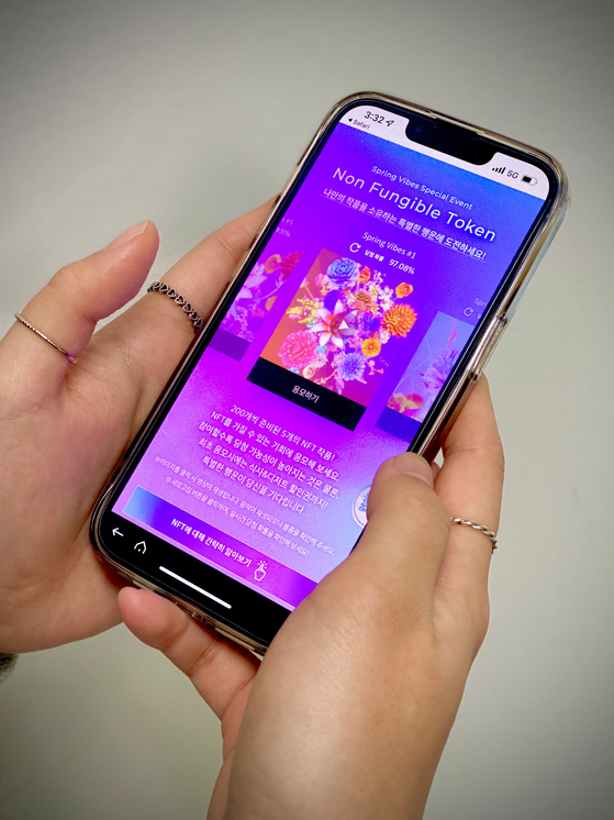 "Spring vibes," a video made into a non-fungible token (NFT), is shown on a smartphone screen. Shinsegae Department Store announced Wednesday it will pick 1,000 people who will receive the NFT for free. Those who want to enter the contest can apply at the department store from Thursday. [SHINSEGAE DEPARTMENT STORE] 