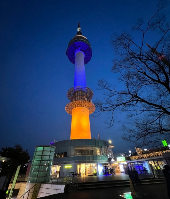 N Seoul Tower on Mount Namsan is lit in the colors of the Ukrainian flag in Seoul. [SEOUL METROPOLITAN GOVERNMENT]