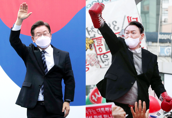 Lee Jae-myung of the Democratic Party, left, and Yoon Suk-yeol of the People Power Party, right, hold campaign rallies in central Seoul on Tuesday. The two are neck and neck in public opinion polls a week ahead of the presidential election. [NEWS1]