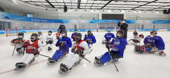 The Korean national ice hockey team trains ahead of the Beijing Paralympics at the National Indoor Stadium in Beijing on Monday' [NEWS1]