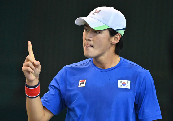 Kwon Soon-woo reacts after making a point against Austria's Jurij Rodionov during the Davis Cup qualifiers in southern Seoul on March 4. [AFP/YONHAP]