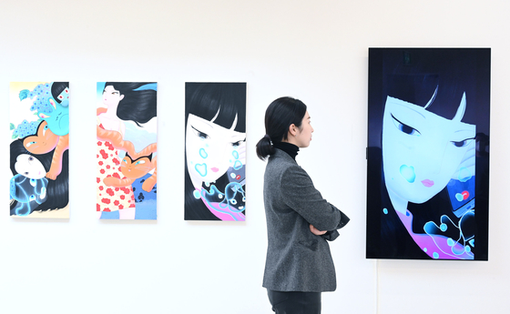 NFT art pieces or blockchain-minted artworks are displayed on LG Electronics organic light-emitting displays (OLEDs). [YONHAP]