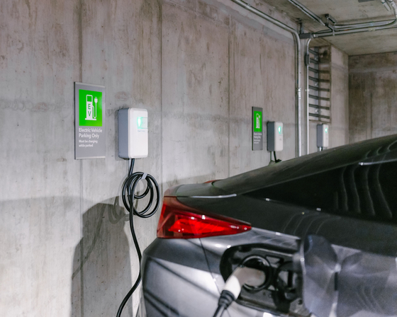 An electric vehicle is being charged by a charger developed by EverCharge. [SK E&S]