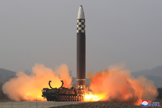 A Hwasong-17 intercontinental ballistic missile (ICBM) is launched from Pyongyang International Airport on Thursday, in a photo released by North Korea's official Korean Central News Agency (KCNA) Friday. [KCNA]