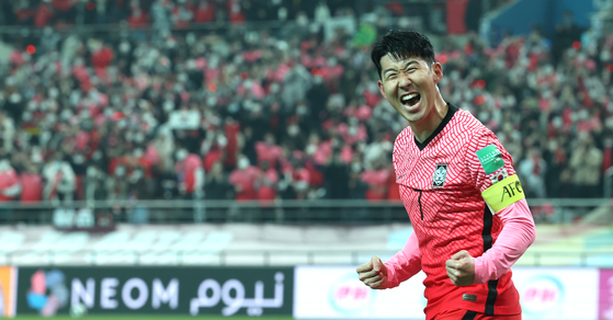 Son Heung-min celebrates after scoring Korea's first goal against Iran in a World Cup qualifier at Seoul World Cup Stadium in western Seoul on Thursday. [YONHAP]