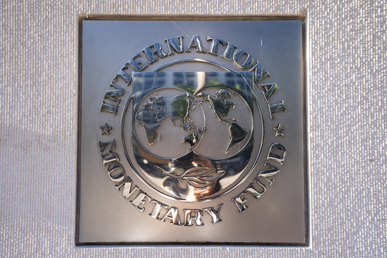  A sign for the International Monetary Fund (IMF) outside its headquarters in Washington, 2020. [EPA/YONHAP] 