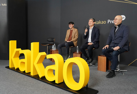 Kakao's board chairman Kim Sung-soo, center, speaks during a press conference on Tuesday. [KAKAO]