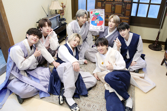 BTS members greet fans wearing hanbok on the New Year's Day in 2021. They wore hanbok in several performances, music videos and media interviews to promote hanbok. [BIG HIT MUSIC] 
