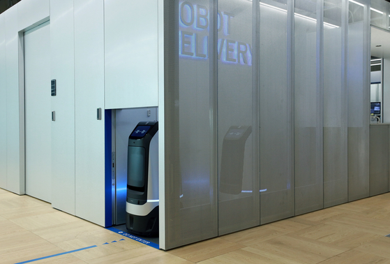 Naver's Rookie delivery robot moves between floors on a robot-only elevator. [NAVER]
