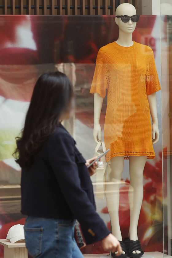 Women's summer clothes are on display at a store in Seoul on Tuesday. Retailers and fashion brands are beginning to offer new apparel collections for summer as Covid-19 restrictions are loosened and the demand for clothes increased. [YONHAP]
