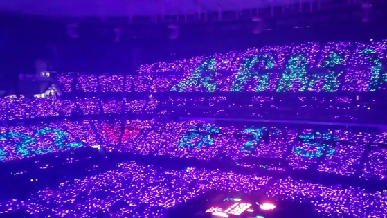 BTS fans spell out "ARMY" (the fandom's name) and "BTS" using Army Bombs, or light sticks for cheering, during a run of the boy band's Las Vegas concert on April 10. [SCREEN CAPTURE]