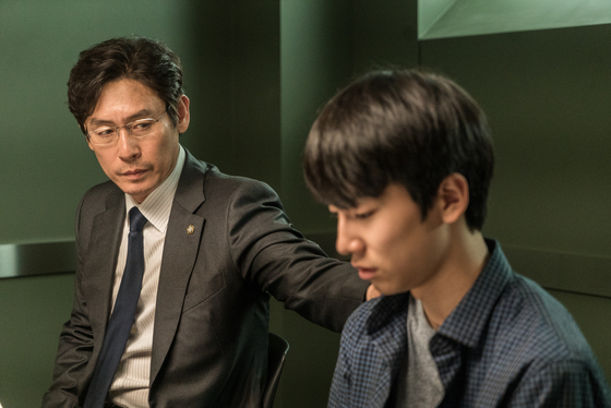 Seol, left, portrays a single father named Kang Ho-chang who firmly believes that his son is different from the other perpetrators accused of bullying a fellow student. [MINDMARK]