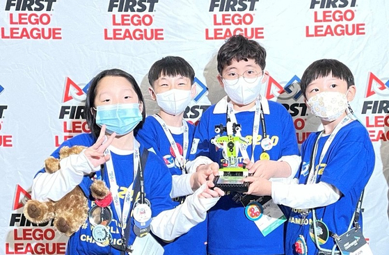 Four Korean students from Gwangju participated in one of the largest robotics competitions in the world, the 2022 FIRST Championship, held in Houston, Texas, last month. [Gwangju Gyelim Elementary School]