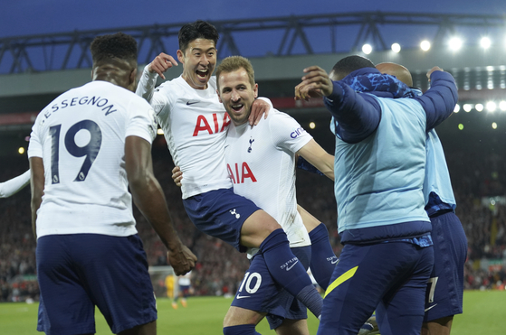 Tottenham's Son Heung-min, second left, celebrates with his teammates after scoring his side's opening goal during the Premier League match between Liverpool and Tottenham Hotspur at Anfield stadium in Liverpool on Saturday. [AP/YONHAP]